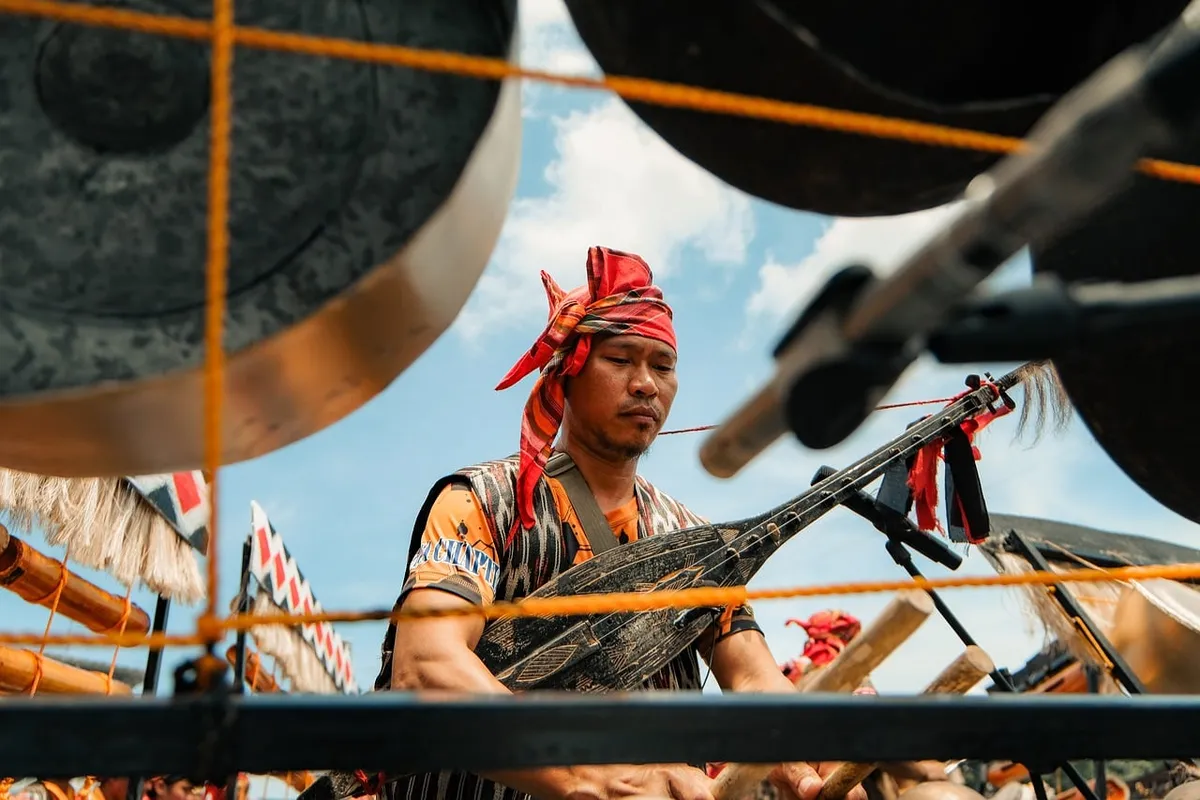 musician, traditional clothing, cultural festival, traditional music, festival, traditional, musical instrument, drum, man, ethnic, outdoor, sky, blue sky, blue