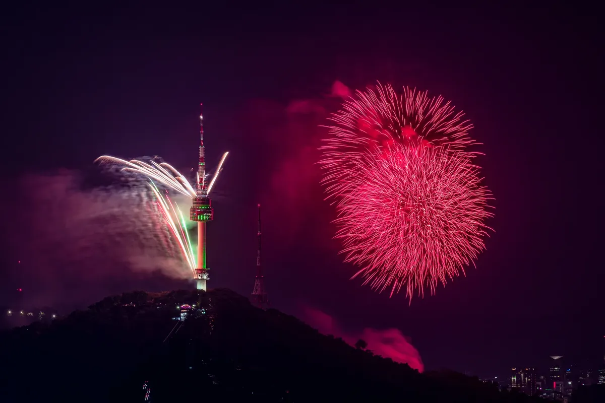 Stunning fireworks display at Namsan Seoul Tower, lighting up the night sky.