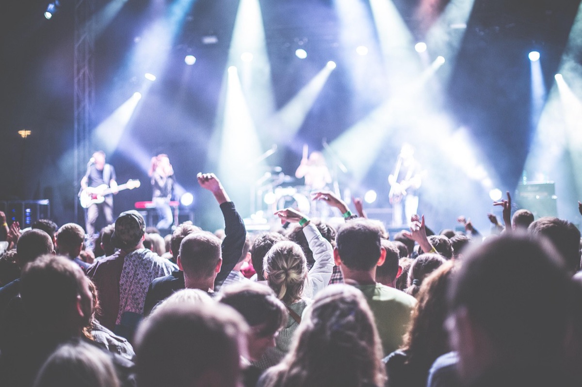 Festival vs Party: Crowd under cool evening tones